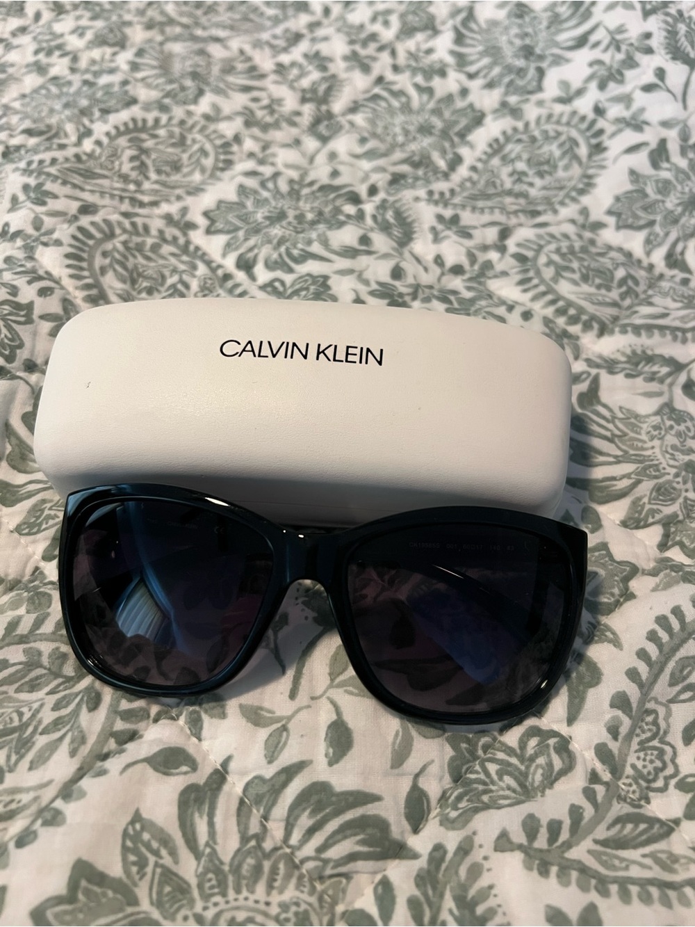 Calvin Klein Black Frame Sunglasses with Dark Lenses
